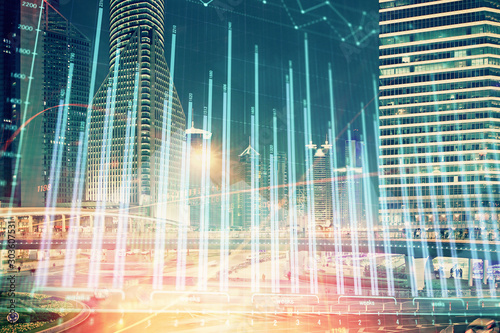 Financial chart on city scape with tall buildings background multi exposure. Analysis concept.