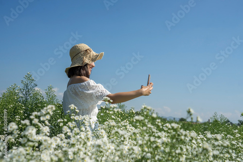 selfie, smartphone, woman, field, grass, summer, nature, young, happy, meadow, people, child, sky, green, outdoors, happiness, beautiful, freedom, fun, spring, beauty, blue, jump, outdoor, joy, flower