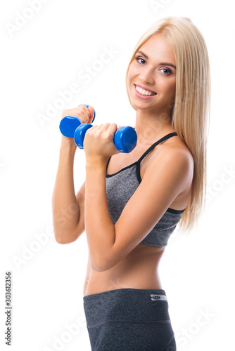 Young happy smiling blond beautiful girl in sportswear, doing fitness exercise with dumbbells, isolated against white background