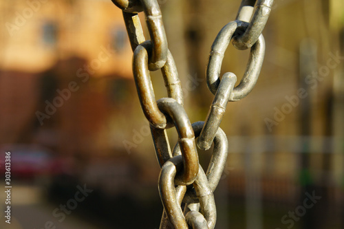 Close up photography of metal chain. Image with defocused background