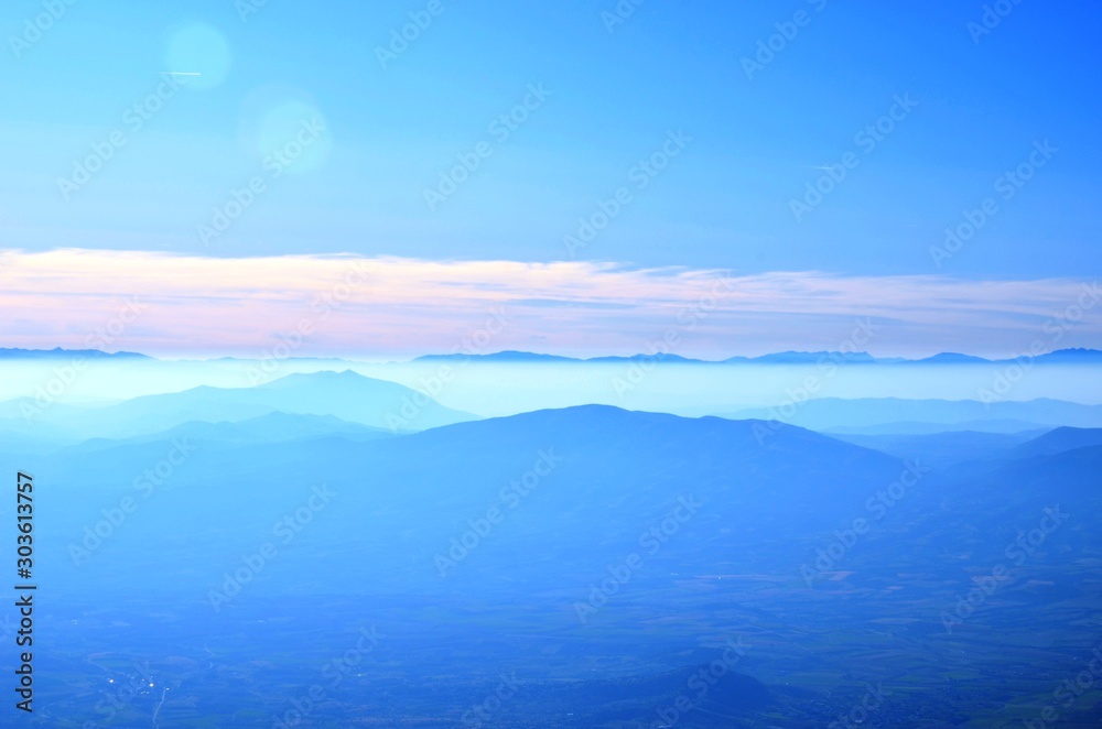 custom made wallpaper toronto digitalPieria, Central Macedonia, Greece, 10/25/19. Mount Olympus landscape - blue mountains, pink fog, blue sky - on the road to Olympus on the West Side. National park of Greece