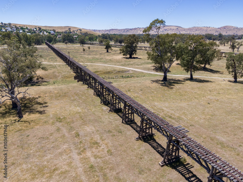 Aerial drone view of the historic Gundagai Railway Viaduct, part of the disused Tumut Railway line near Murrumbidgee River in Gundagai, New South Wales, Australia. The site is a popular for tourists.