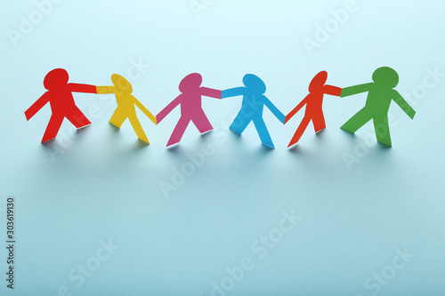 Colorful paper chain people on blue background