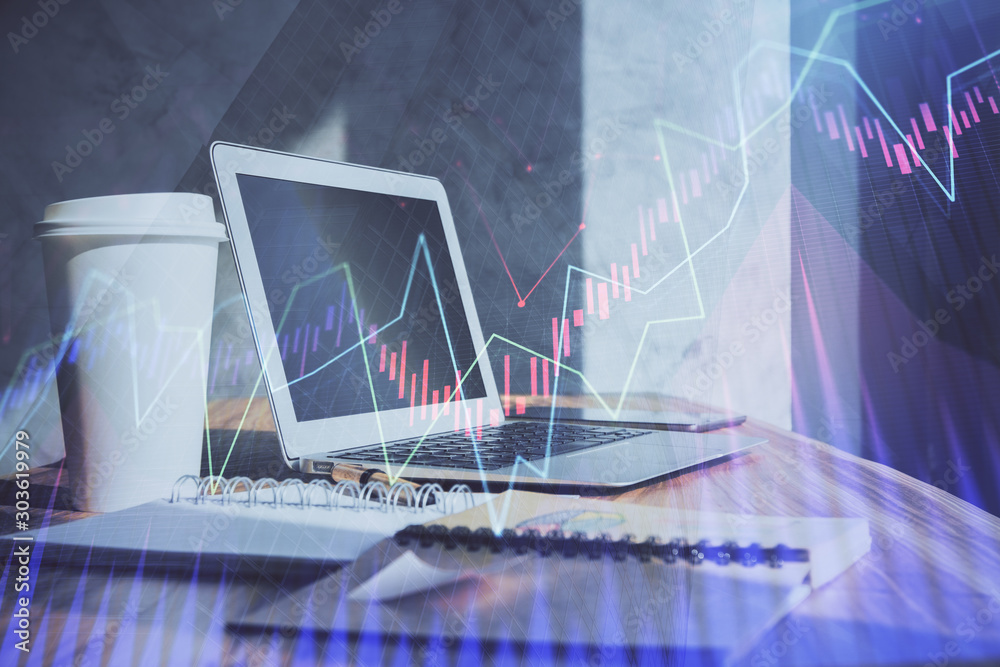 Stock market graph on background with desk and personal computer. Double exposure. Concept of financial analysis. Stock market graph on background with desk and personal computer. Double exposure. Concept of financial analysis.