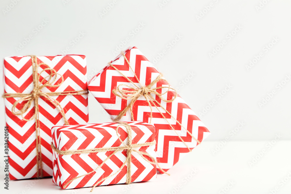 Fototapeta premium Gift boxes with ropes on white background