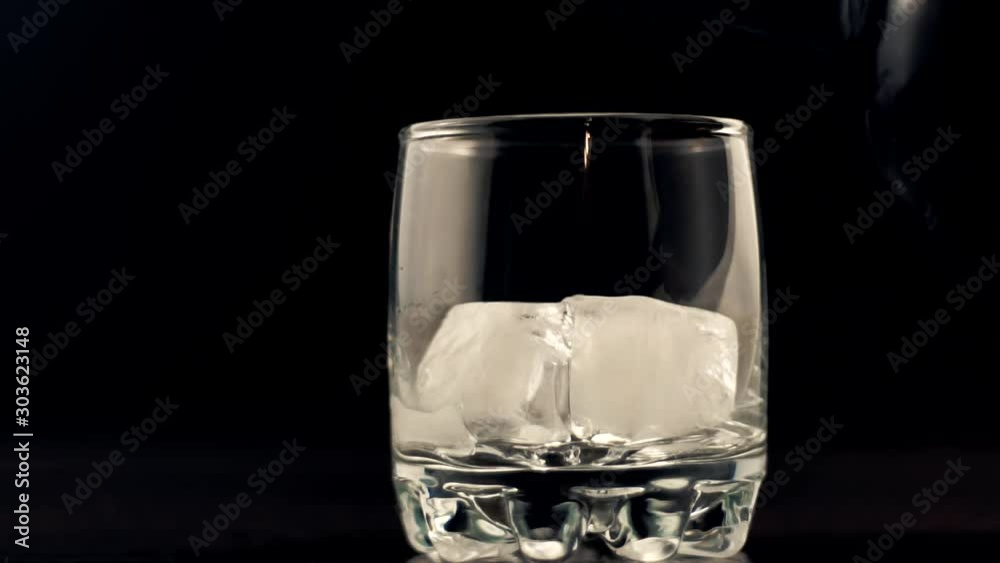 Whiskey Pouring In Glass.Cognac In Glass Floats In Slow Motion.Bourbon Or Rum Pouring In Slow Motion.Running Brandy In Glass From Bottle.Rum Flowing From Brown Bottle. Whiskey Pouring In Glass.Cognac In Glass Floats In Slow Motion.Bourbon Or Rum Pouring In Slow Motion.Running Brandy In Glass From Bottle.Rum Flowing From Brown Bottle.