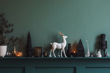 Christmas composition on the shelf in the living room interior. Beautiful decoration. Christmas trees, candles, stars, light and elegant accessories. Merry Christmas and Happy Holidays, Template. 