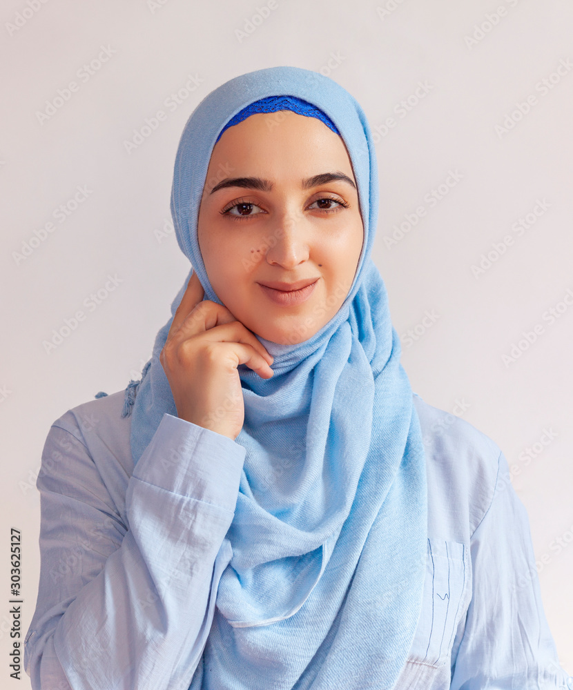 Beautiful Muslim woman in hijab against white background. Portrait ...