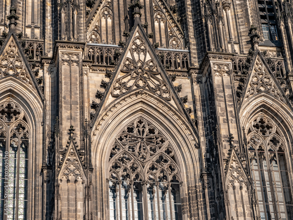 Gothic Cathedral Church of Saint Peter in Cologne, Germany on a sunny day. Beautiful cityscape with details of the towers, arches and windows stained glass