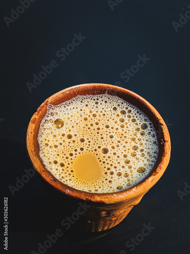 Indian Refreshing Milk Tea in a Clay pot. photo