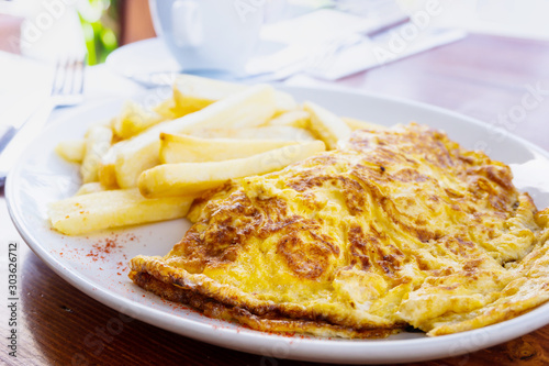 omelet with ham tomato and green french fries