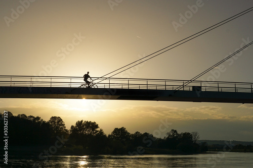 A bridge in Dresden Pieschen on the Elbe Cycle Route during sunset photo
