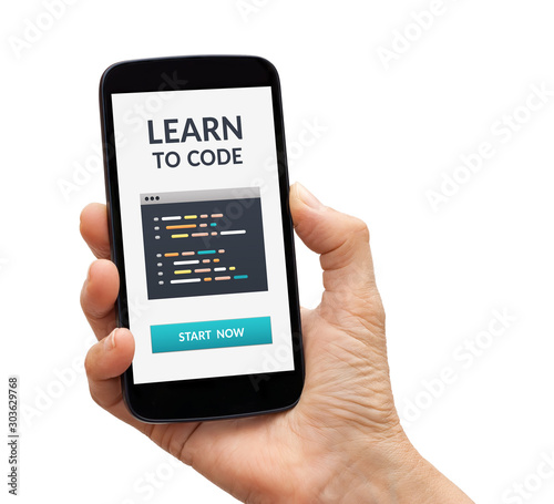 Hand holding a black smart phone with learn to code concept on screen. Isolated on white background
