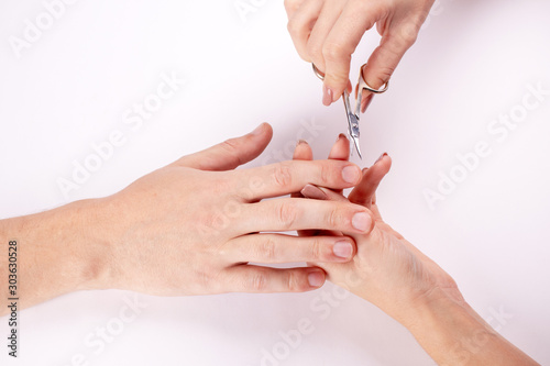 Man s manicure in salon. Beauty and care concept. Beauty promotion. Spa  manicuring  processing of nails. Beautiful male hands.