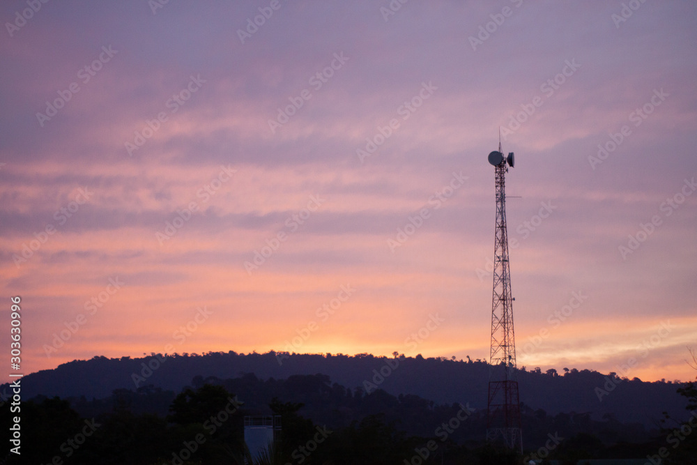 communication tower at sunset communication tower at sunset