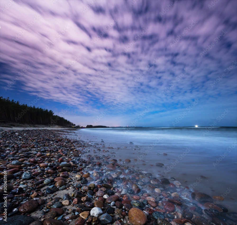 seashore, pebbles, clear night during a full moon, the Baltic Sea