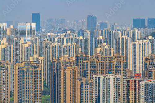 Chongqing, China - March 20, 2018: Endless Chinese city of Chongqing. City blocks going into the distance. Haze rises over the city.