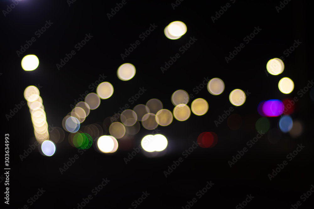 Blurred colorful city lights above the road Blurred colorful city lights above the road