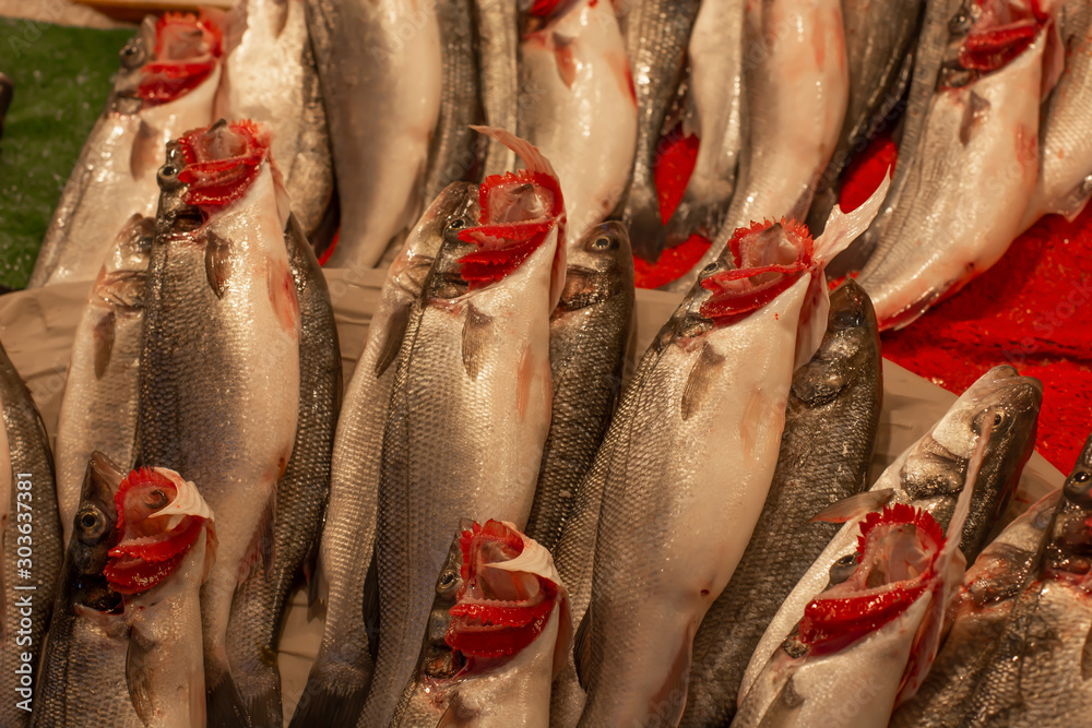 Obraz premium sea bass fish on fish table