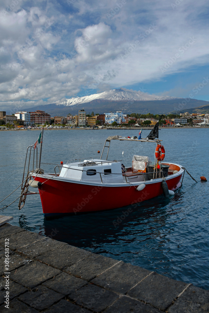 Giardini-Naxos touristic resort with beautiful Etna volcano covered with snow on Sicili, Italy Giardini-Naxos touristic resort with beautiful Etna volcano covered with snow on Sicili, Italy