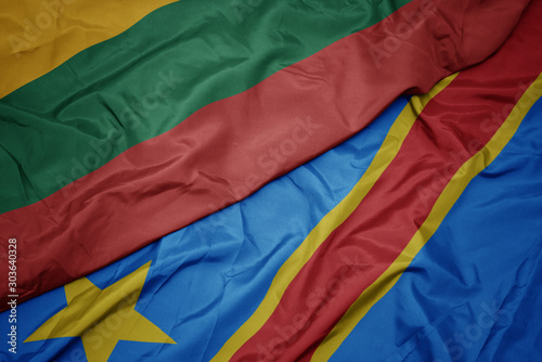 waving colorful flag of democratic republic of the congo and national flag of lithuania.