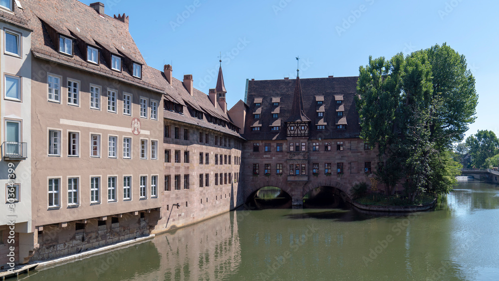 sunny historic nuremberg city buildings by the river pegnitz, germany