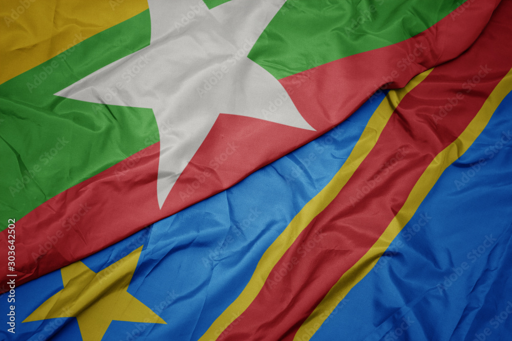 waving colorful flag of democratic republic of the congo and national flag of myanmar.