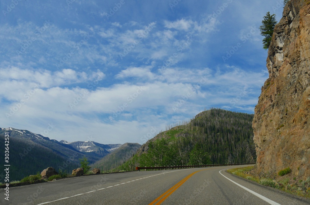 Dramatic twists and turns on the road along cliffsides at Yellowstone National Park, Wyoming.