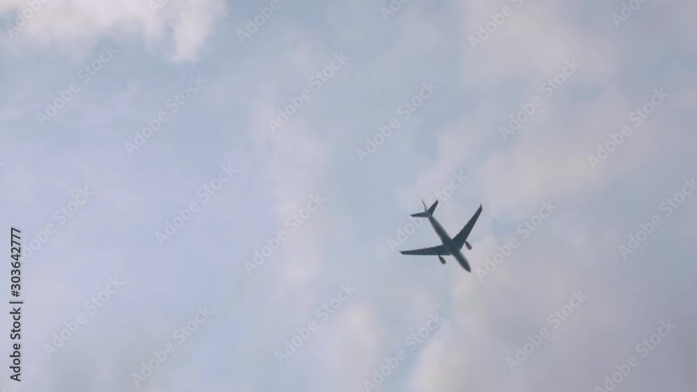 Plane flies in clouds sky cloudy weather look up view