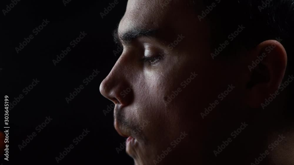 Young guy eating carrots, healthy food, vegetable diet
