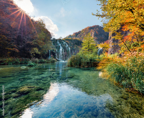 Stunning morning view of pure water waterfall in Plitvice National Park. Great autumn sunrise in Croatia  Europe. Abandoned places of Plitvice lakes series. Beauty of nature concept background.