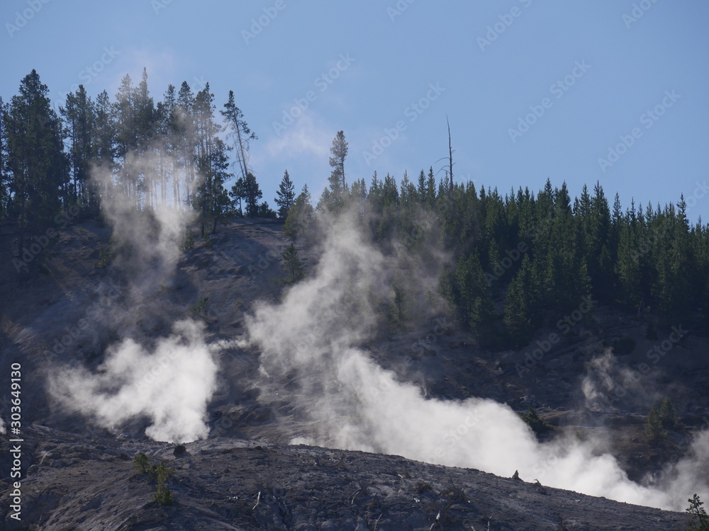 Close up of steam rising from fumaroles at the Roaring Mountain at Yellowstone National Park, Wyoming.