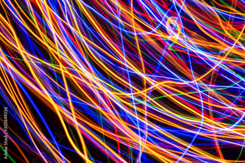 Colorful lights on the long exposure with motion background, Abstract glowing colorful lines, slow speed shutter.