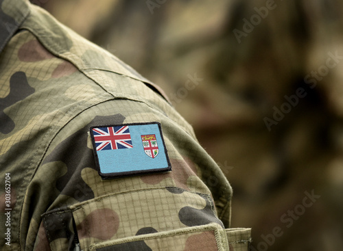 Flag of Fiji on military uniform. Army, armed forces, soldiers. Collage.