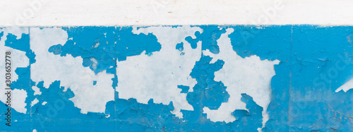 Texture of old peeling paint, vintage graffiti background, it's time to make repairs, cracked paint texture.  Clipart, white, blue old paint, panoramic photo