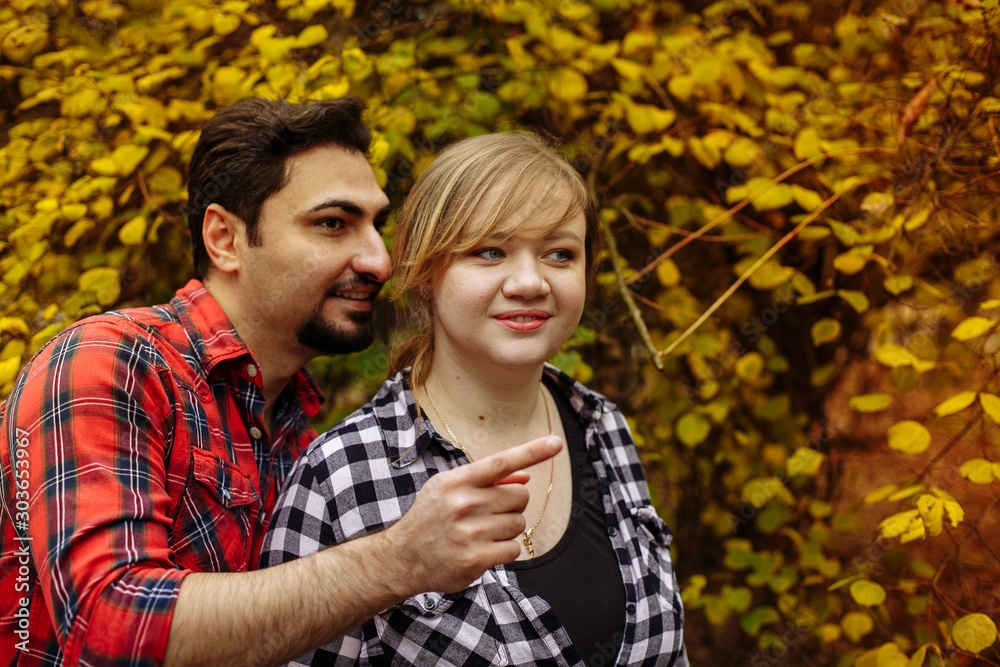 Loving couple in plaid shirts. Loving couple in plaid shirts.