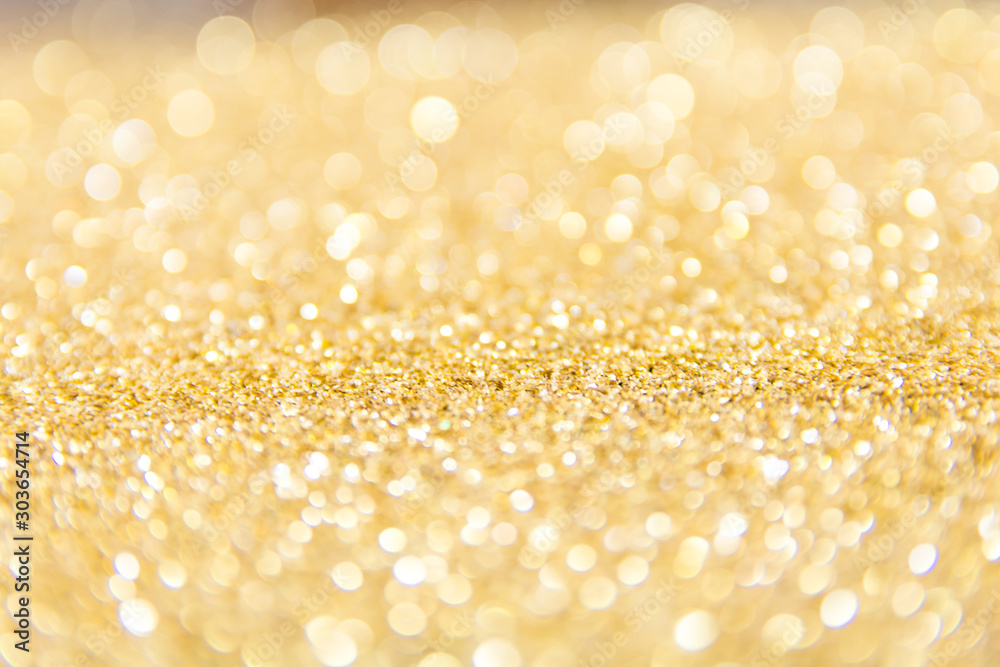 Defocused gold glitter background. Gold abstract bokeh background. Christmas abstract background. Defocused gold glitter background. Gold abstract bokeh background. Christmas abstract background.