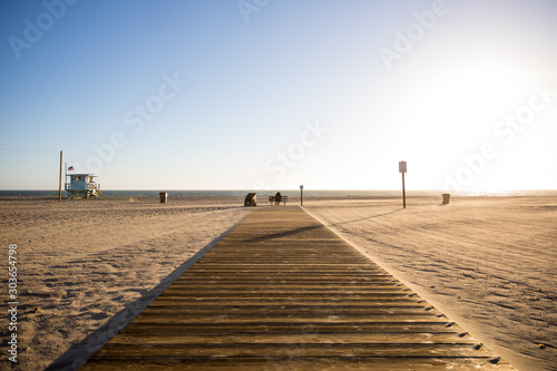 A beach pier with people