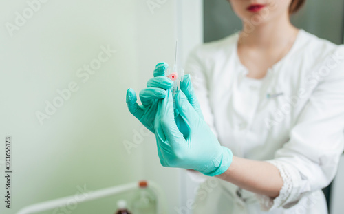 Close up view of doctor holding urinary catheter ready to use