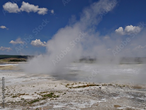 Steam rising from the Clepsydra Geyser at the Lower Geyser Basin, Yellowstone National Park.
