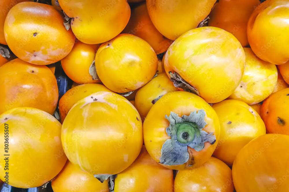 A lot of yellow persimmon in the super market