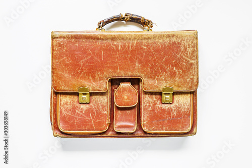 Old leather briefcase in white background