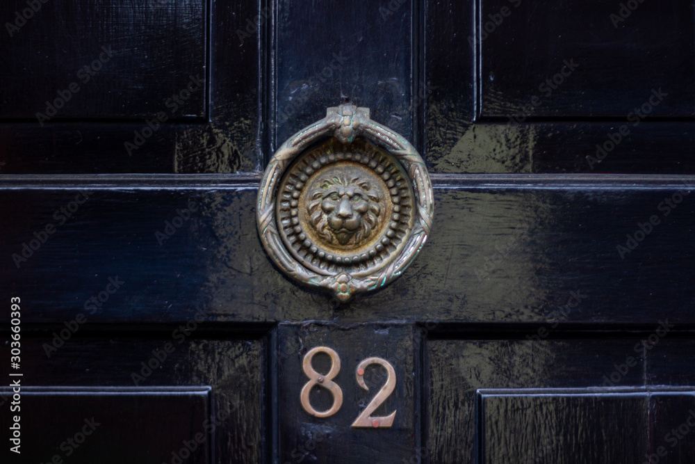 House number 82 with lion's head door knocker House number 82 with lion's head door knocker