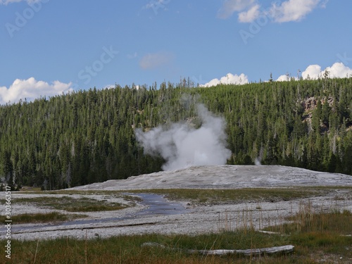 Old Faithful is a cone geyser that erupts regularly every 90 minutes atYellowstone National Park, Wyoming.