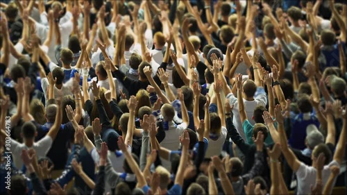 United crowd of sports fans, togetherness, unanimity. Soccer fans cheering. Football fans enjoying the game