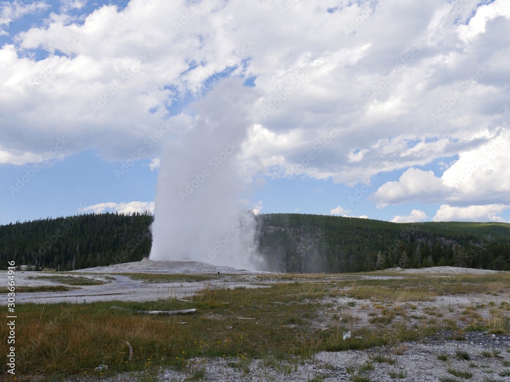 Eye-popping show of scalding water and steam spewing out of Old Faithful geyser during one of its regular eruptions at Yellowstone National Park, Wyoming. Eye-popping show of scalding water and steam spewing out of Old Faithful geyser during one of its regular eruptions at Yellowstone National Park, Wyoming.