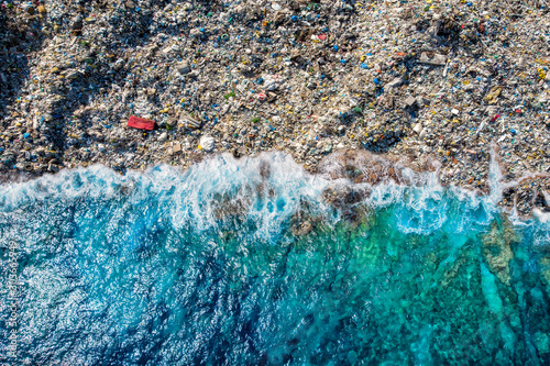 Concept environmental pollution ocean and water with plastic and human waste. Aerial top view photo