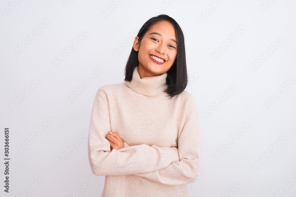Young chinese woman wearing turtleneck sweater standing over isolated white background happy face smiling with crossed arms looking at the camera. Positive person. Young chinese woman wearing turtleneck sweater standing over isolated white background happy face smiling with crossed arms looking at the camera. Positive person.