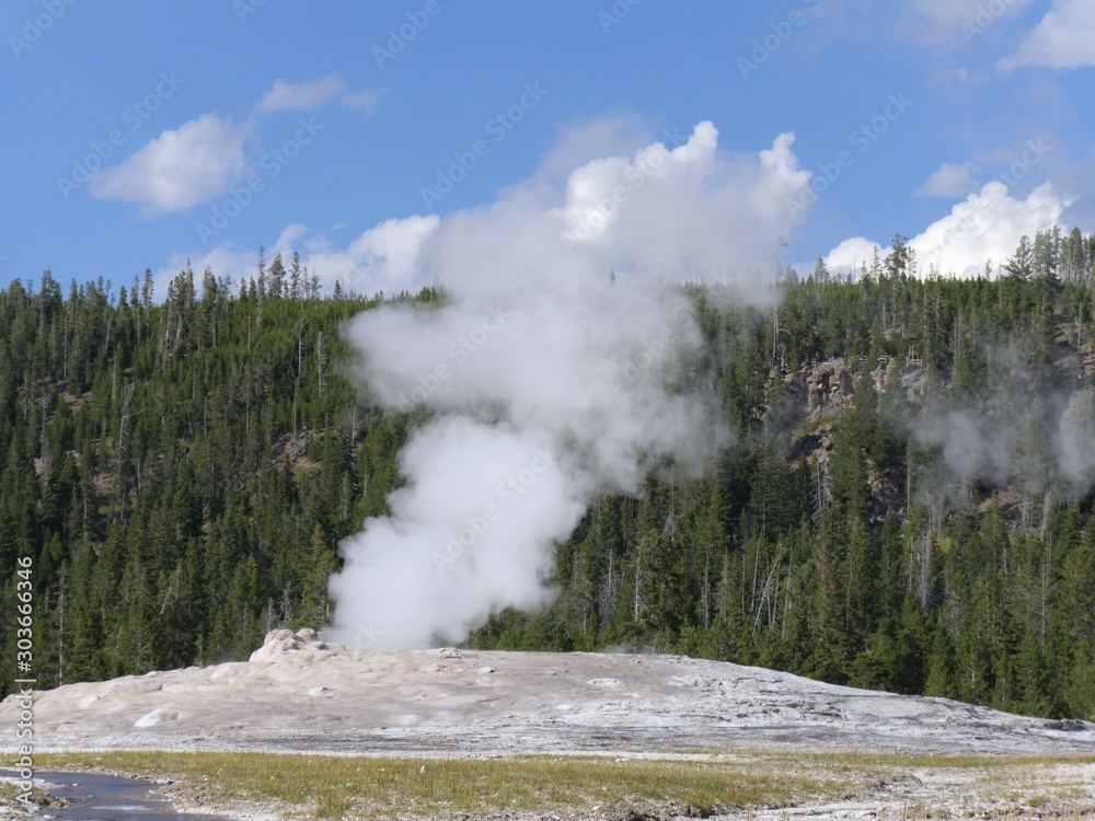 Hot water and steam bellows out of the Old Faithful geyser during one of its regular eruptions at Yellowstone National Park, Wyoming. Hot water and steam bellows out of the Old Faithful geyser during one of its regular eruptions at Yellowstone National Park, Wyoming.