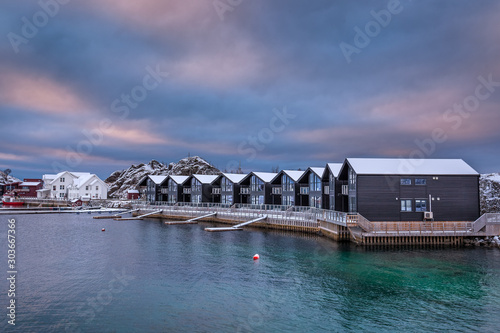 Blue Hour after sunset time in winter season, Village is covered with snow. The famous tourist attraction Hamn Village, Senja Islands, Norway